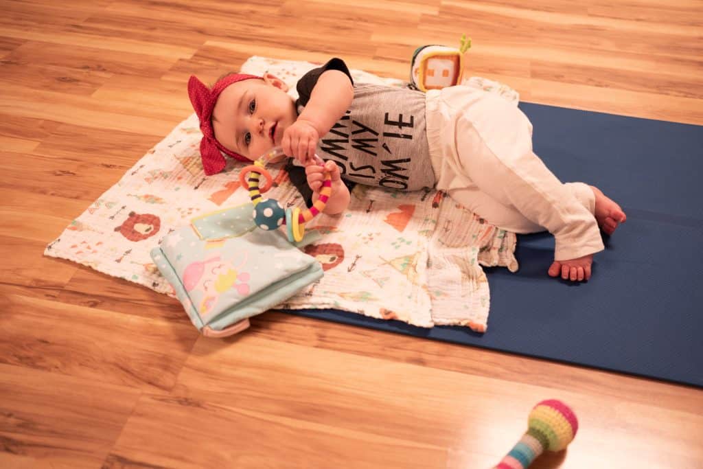 A young participant in baby & me yoga at Hartford Sweat
