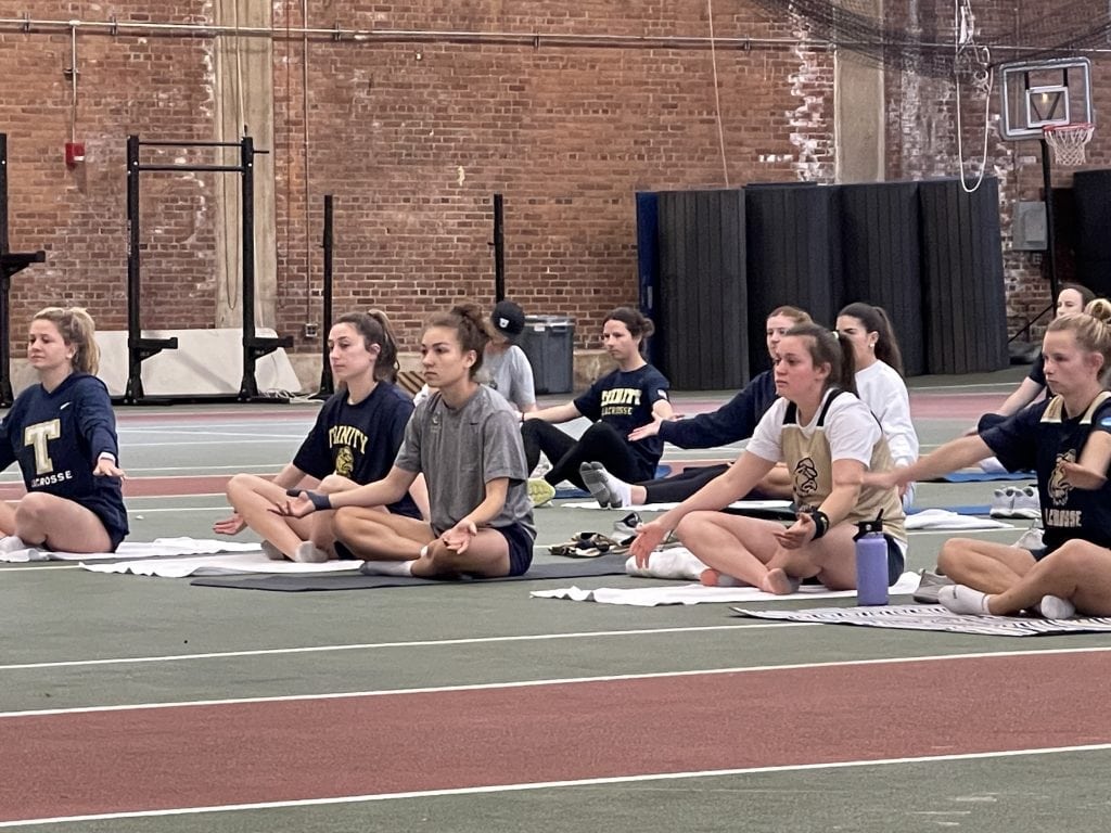 Trinity Lacrosse team participating in a private class session
